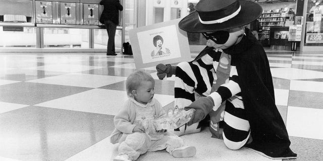 The Hamburglar, 在这里看到 1991 actually giving away a Happy Meal, was originally introduced in 1971. (Hank DeGeorge/Chicago Tribune/Tribune News Service via Getty Images)