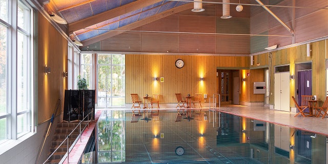 The grounds include a spa and bathhouse, in addition to homes, a preschool, a restaurant/hotel and an operational beverage production site.