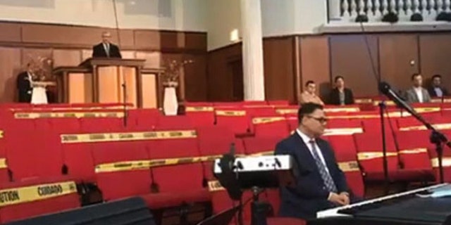 Cristian Ionescu, a senior pastor of Elim Romanian Pentecostal Church in Chicago, Ill., held a service Sunday, May 10, 2020 in defiance of Gov. J.B. Pritzker's stay-at-home orders during the coronavirus pandemic as states begin to reopen. (Liberty Counsel)