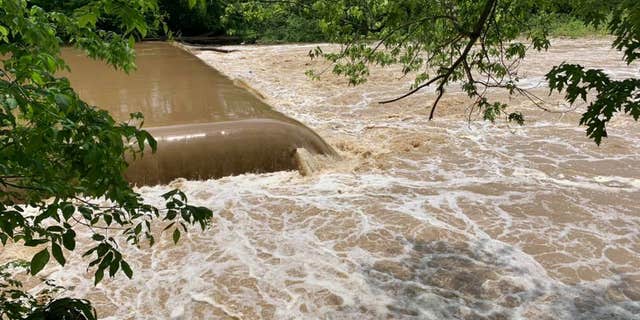Officers launched a boat and set up a tag line across the river and sent a rescue swimmer to try and catch the man before he was swept over the Milltown Dam.