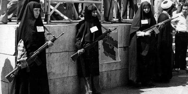 Armed women on guard and participating in Khordad in one of the main squares in Tehran at the beginning of the Iranian Revolution. (Photo by Keystone/Getty Images)