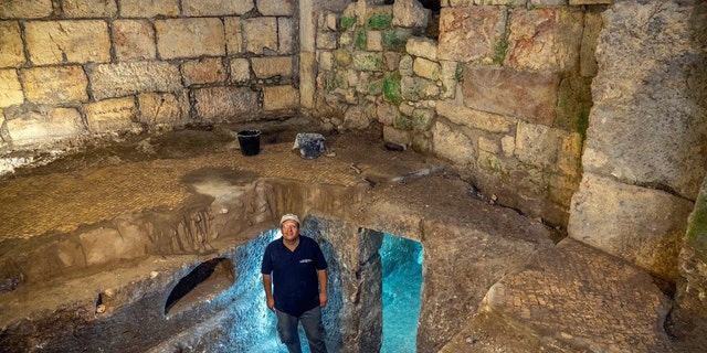 Dr. Barak Monnickendam-Givon at the subterranean system.