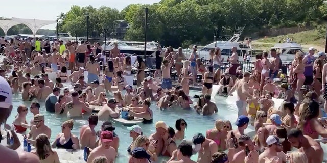 Revelers celebrate Memorial Day weekend at Osage Beach of the Lake of the Ozarks, Missouri, U.S., May 23, 2020 in this screen grab taken from social media video and obtained by Reuters on May 24, 2020.