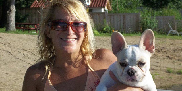 This 2011 Facebook photos shows Lisa Urso with one of her French bulldogs.