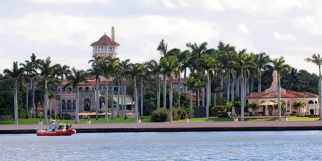 A U.S. Coast Guard boat passes through the Mar-a-Lago Resort (Photo by Gerardo Mora/Getty Images)