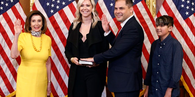 Pelosi swears in two new GOP members of Congress 3 House Speaker Nancy Pelosi of Calif., left, conducts a ceremonial swearing-in for Rep. Mike Garcia, R-Calif., second from right, joined by his wife Rebecca and son Preston, on Capitol Hill in Washington, Tuesday, May 19, 2020. (AP Photo/Patrick Semansky)