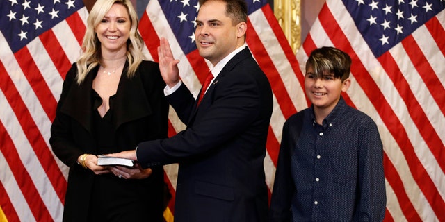 Rep. Mike Garcia, R-Calif., joined by his wife Rebecca and son Preston, participates in a ceremonial swearing-in on Capitol Hill in Washington, D.C., Tuesday, May 19, 2020. (AP Photo/Patrick Semansky)