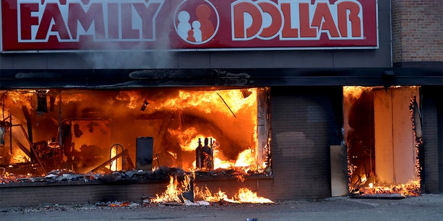 Fire burns inside The Family Dollar Store after a night of unrest and protests in the death of George Floyd early Friday, May 29, 2020 in Minneapolis. Floyd died after being restrained by Minneapolis police officers on Memorial Day. (David Joles/Star Tribune via AP)