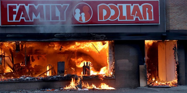 Fire burns inside The Family Dollar Store after a night of unrest and protests in the death of George Floyd early Friday, May 29, 2020 in Minneapolis. Floyd died after being restrained by Minneapolis police officers on Memorial Day. (David Joles/Star Tribune via AP)