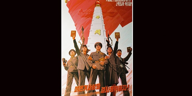 North Korean propaganda urging their citizens to keep the red flag thought, or communism, alive.