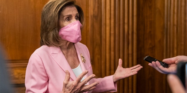 House Speaker Nancy Pelosi of Calif., talks to reporters on Capitol Hill, Tuesday, May 5, 2020, in Washington. (AP Photo/Manuel Balce Ceneta)