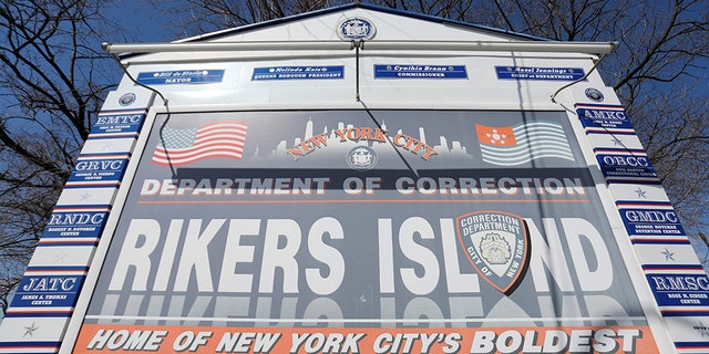 Signage is seen outside of Rikers Island, a prison facility, where multiple cases of the coronavirus disease (COVID-19) have been confirmed in Queens, New York City, U.S., March 22, 2020. (REUTERS/Andrew Kelly)