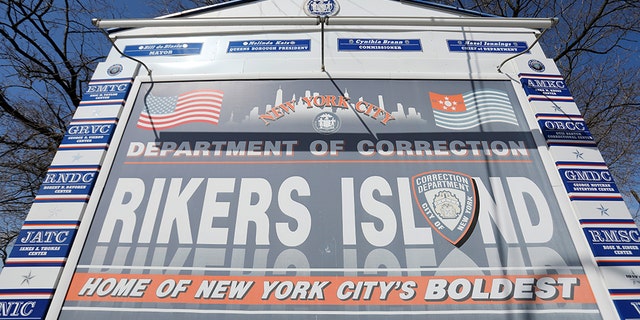 Signage is seen outside of Rikers Island, a prison facility, where multiple cases of the coronavirus disease (COVID-19) have been confirmed in Queens, New York City, U.S., March 22, 2020. (REUTERS/Andrew Kelly)