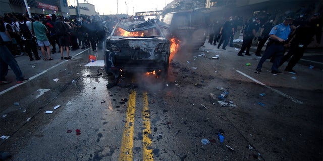 An Atlanta Police Department vehicle burns during a demonstration against police violence, Friday, May 29, 2020 in Atlanta. The protest started peacefully earlier in the day before demonstrators clashed with police. (Associated Press)
