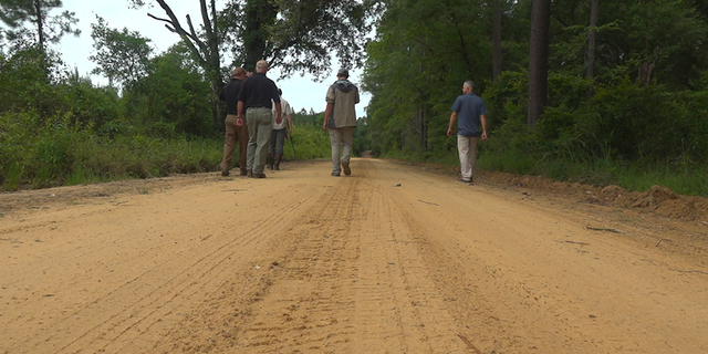 The US Geological survey team works to capture Tegu lizards in Reidsville GA