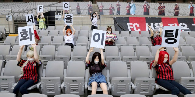 Cheering mannequins are installed at the empty spectators' seats before the start of the soccer match between FC Seoul and Gwangju FC at the Seoul World Cup Stadium in Seoul, South Korea. (Ryu Young-suk/Yonhap via AP)