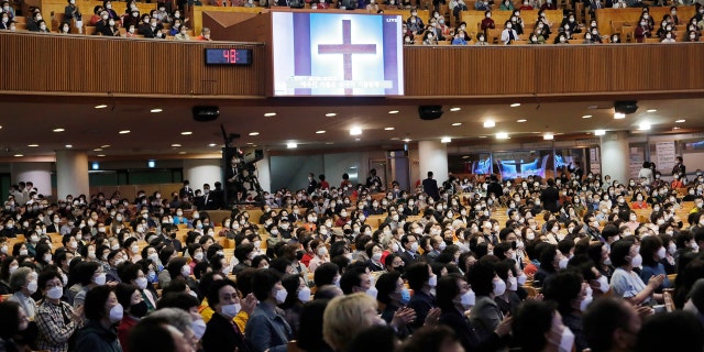 Christians wearing face masks attend a service at the Yoido Full Gospel Church in Seoul, South Korea, Sunday, May 10, 2020.