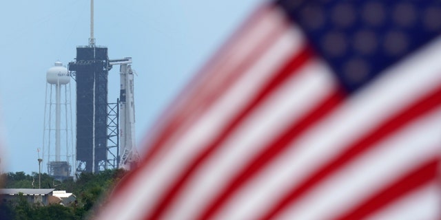 A SpaceX Falcon 9, with NASA astronauts Doug Hurley and Bob Behnken in the Crew Dragon capsule, sits on Launch Pad 39-A at the Kennedy Space Center in Cape Canaveral, Fla., Saturday, May 30, 2020.
