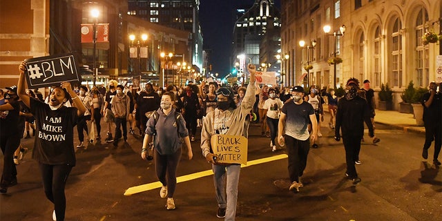 Protesters rally as they march through the streets on May 29, 2020 in St. Louis, Missouri.  (Photo by Michael B. Thomas/Getty Images)