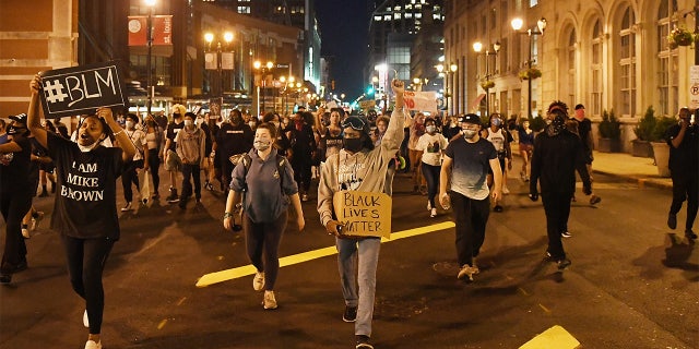 Protesters rally as they march through the streets on May 29, 2020 in St. Louis, Missouri. (Photo by Michael B. Thomas/Getty Images)