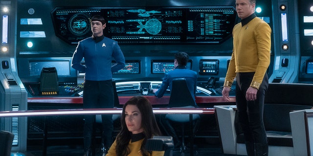 This image released by CBS All Access shows, from left, Ethan Peck as Spock, Rebecca Romijn as Number One, and Anson Mount as Captain Pike of the the CBS All Access series