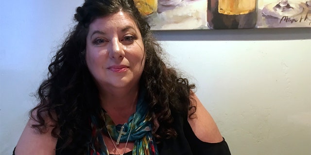 In this April 4, 2019, photo Tara Reade poses for a photo during an interview with The Associated Press in Nevada City, Calif. (AP Photo/Donald Thompson)