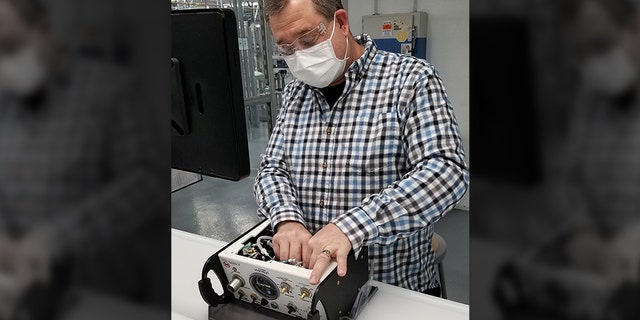 President Trump will visit Ford Motor Company’s Rawsonville plant in Michigan on May 21, 2020, which is making ventilators for the coronavirus pandemic. Ford employee Terry Bowman is seen here working on a ventilator.
