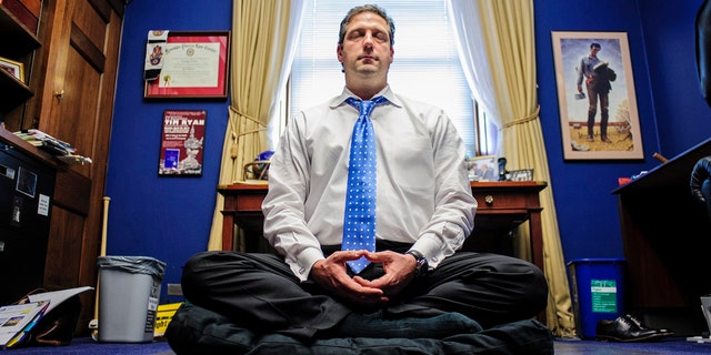 Rep. Tim Ryan meditating in his office.
