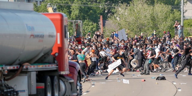 A tanker truck drives into thousands of protesters marching on 35W north bound highway during a protest against the death in Minneapolis police custody of George Floyd, in Minneapolis, Minnesota, U.S. May 31, 2020.