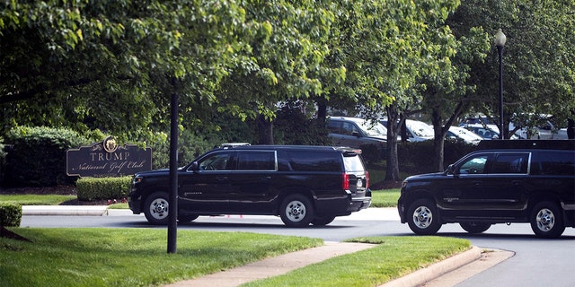 The motorcade for President Donald Trump arrives at Trump National Golf Club, Saturday, May 23, 2020, in Sterling, Va. 
