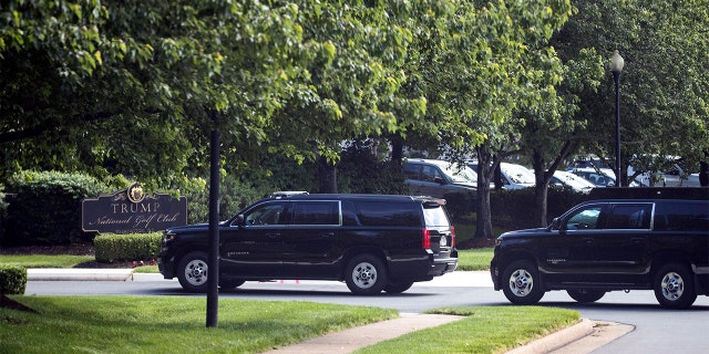 The motorcade for President Donald Trump arrives at Trump National Golf Club, Saturday, May 23, 2020, in Sterling, Va. 