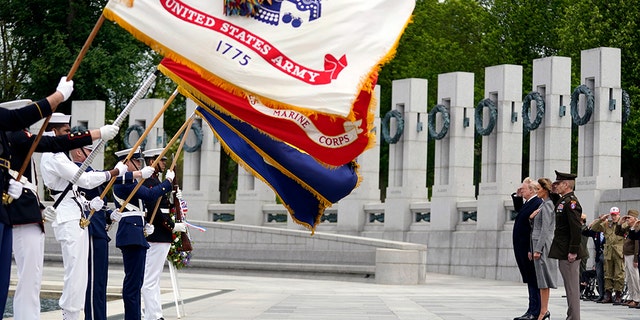 President Donald Trump and first lady Melania Trump participate in a ceremony at the World War II Memorial to commemorate the 75th anniversary of Victory in Europe Day, Friday, May 8, 2020, in Washington. (AP Photo/Evan Vucci)