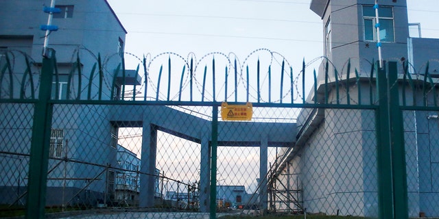 A perimeter fence is built around what is officially known as a vocational training center in Dabancheng, Xinjiang province, China, September 4, 2018.