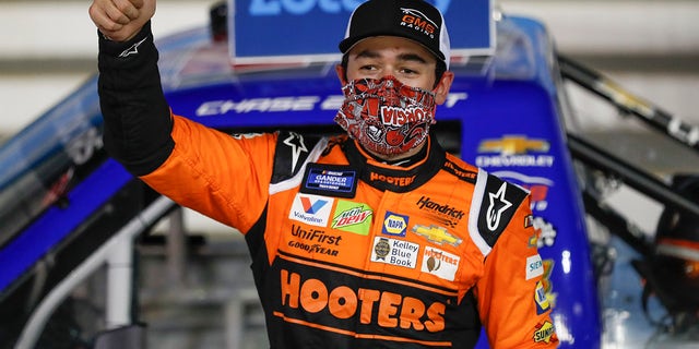 Chase Elliott celebrates after winning the NASCAR Truck Series auto race at Charlotte Motor Speedway Tuesday, May 26, 2020, in Concord, N.C. (Associated Press)