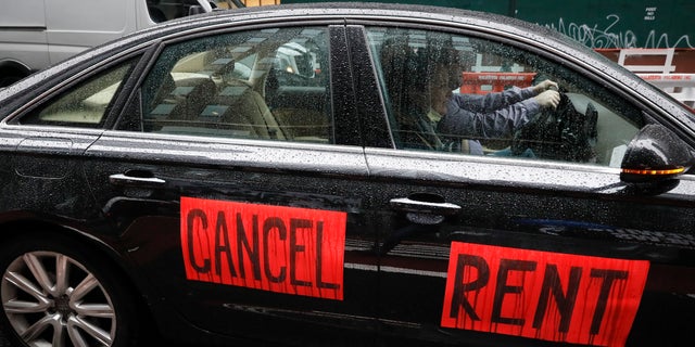 A sign with the message to cancel rent is displayed on a vehicle in New York City. (AP)
