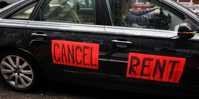 A sign with the message to cancel rent is displayed on a vehicle in New York City. (AP)