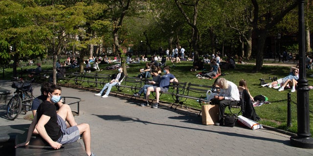 New Yorkers flock to Washington Square Park on a sunny day amid the coronavirus pandemic.
