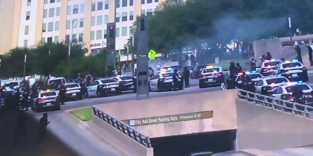 Dallas SWAT deployed gas to disperse the unruly protesters at the corner of Young and Akard Street on Saturday, police said.