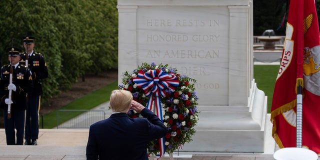 Melania Trump President Donald Trump salutes after placing a wreath at the Tomb of the Unknown Soldier in Arlington National Cemetery, in honor of Memorial Day, Monday, May 25, 2020, in Arlington, Va. (AP Photo/Alex Brandon)
