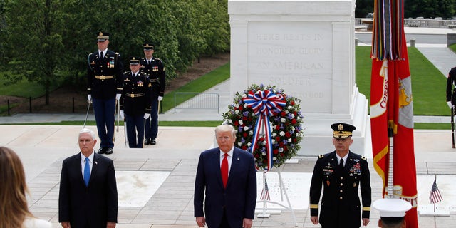 Melania Trump President Donald Trump stands with Vice President Mike Pence and Gen Omar Jones, Commanding General at Joint Force Headquarters, National Capital Region and United States Army Military District of Washington, at the Tomb of the Unknown Soldier in Arlington National Cemetery, in honor of Memorial Day, Monday, May 25, 2020, in Arlington, Va. (AP Photo/Alex Brandon)