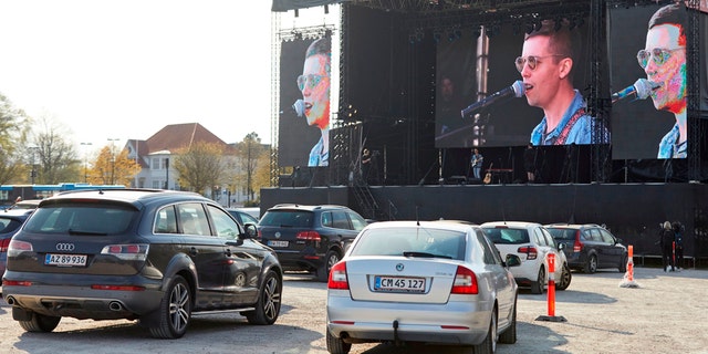 Danish singer and songwriter Mads Langer preforms at a sold-out drive-in concert at Tangkrogen in Aarhus, Denmark on April 24, 2020. (Photo by Mikkel Berg Pedersen / Ritzau Scanpix / AFP) / Denmark OUT (Photo by MIKKEL BERG PEDERSEN/Ritzau Scanpix/AFP via Getty Images)