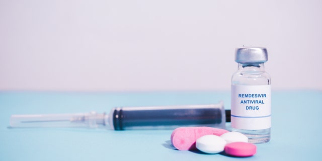 Remdesivir antiviral drug with pills and Syringe as background - concept of covd-19 or coronavirus new possible antiviral drug medication (Credit: iStock)
