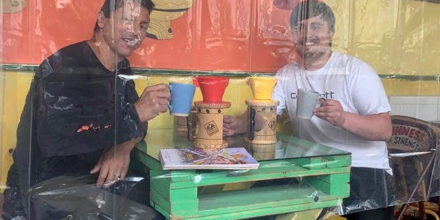 "I know it's a little bit weird to come into a cafe full of shower curtains because we are not used to that type of environment,” said cafe owner Francini Osorio. "But the way things are I don't know what else to do.
