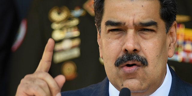 March 12, 2020: Venezuelan President Nicolas Maduro gives a press conference at Miraflores presidential palace in Caracas, Venezuela. In a fishing village on Margarita Island, more than 90 COVID-19 infections linked to a baseball academy that traveled to the Dominican Republic and returned set off alarms. Maduro was one of the firsts to react, calling the academy directors “irresponsible” amid his presidential order to quarantine, which prohibited gatherings like those held at the academy upon their return. Also infected were national guards providing security at the sports center, and inhabitants of the town and other neighboring towns on Margarita Island. (AP Photo/Matias Delacroix)