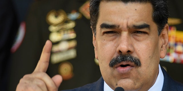 March 12, 2020: Venezuelan President Nicolas Maduro gives a press conference at Miraflores presidential palace in Caracas, Venezuela. In a fishing village on Margarita Island, more than 90 COVID-19 infections linked to a baseball academy that traveled to the Dominican Republic and returned set off alarms. Maduro was one of the firsts to react, calling the academy directors “irresponsible” amid his presidential order to quarantine, which prohibited gatherings like those held at the academy upon their return. Also infected were national guards providing security at the sports center, and inhabitants of the town and other neighboring towns on Margarita Island. (AP Photo/Matias Delacroix)