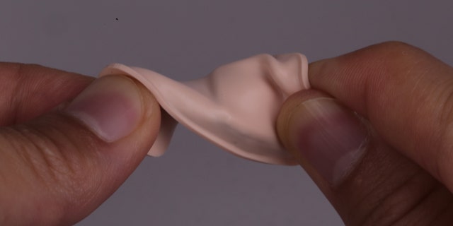 The new device is flexible and adheres to the base of the throat, where doctors typically perform tracheotomies.