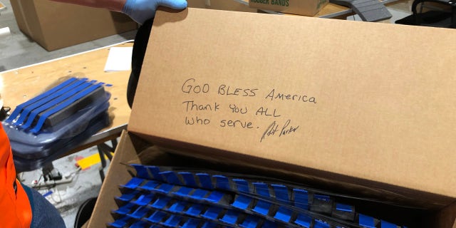 Ford Motor Co. worker leaves a message to the military who will receive their face shields. (Ford Motor Co. photo)
