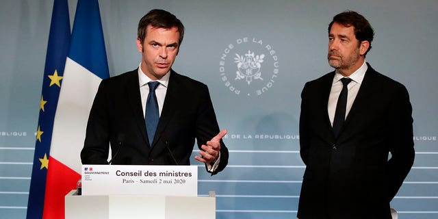 French Minister for Solidarity and Health Olivier Veran, left, and French Interior Minister Christophe Castaner attend a press conference in Paris on Saturday as nationwide confinement to counter the COVID-19 virus continues until May 11 . (AP Photo/Francois Mori, pool)