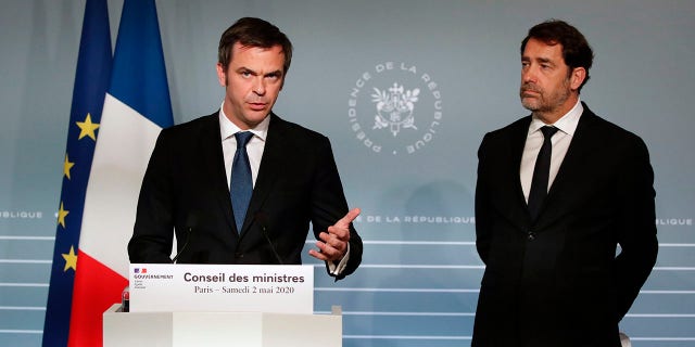 French Minister for Solidarity and Health Olivier Veran, left, and French Interior Minister Christophe Castaner attend a press conference in Paris on Saturday as nationwide confinement to counter the COVID-19 virus continues until May 11 . (AP Photo/Francois Mori, pool)