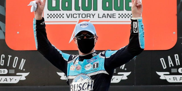 Harvick donned a facemask on the winner's podium in keeping with the health and safety protocols in place at the track.